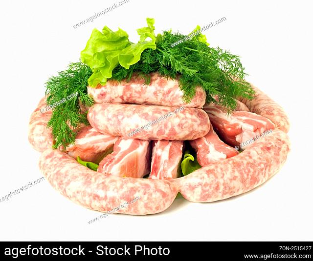 Tasty meat. Pieces of Pork and Sausages. Isolated over white