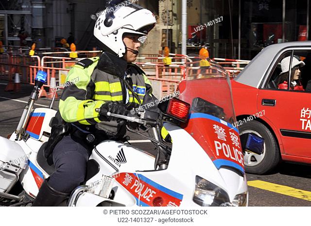 Hong Kong: policeman on a motor-bike in Tsim Sha Tsui