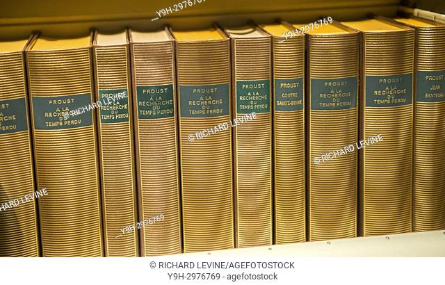A collection of volumes of Marcel Proust books including various volumes of ""À la recherche du temps perdu"" (In Search of Lost time)