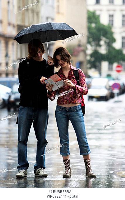 Couple with umbrella in the rain