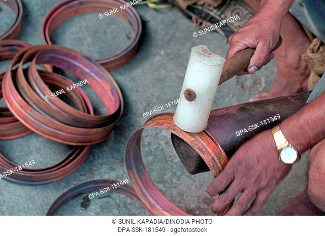 Copper base ring hammered for proper flatness Pune Maharashtra India Asia Feb 2012