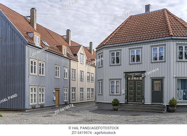 TRONDHEIM, NORWAY - July 18 2019: cityscape with old picturesque traditional houses on crossing cobbled streets, shot under bright morning light on july 18