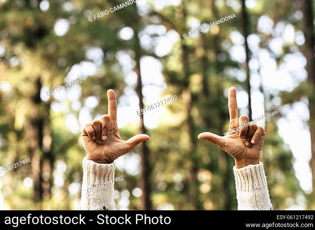 Nature and save forest trees world with hands of woman nad green background wood - your text here and copy space concept environement image - no deforestation...