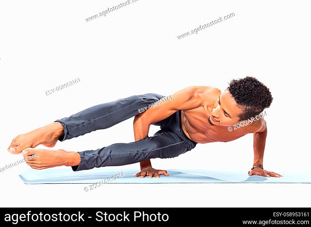 Young man doing yoga asana poses exercise studio photo isolated on white background