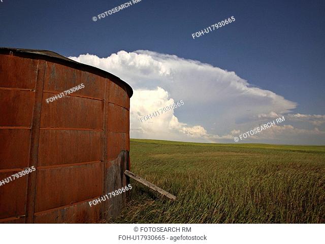 background summer wooden granary clouds in storm