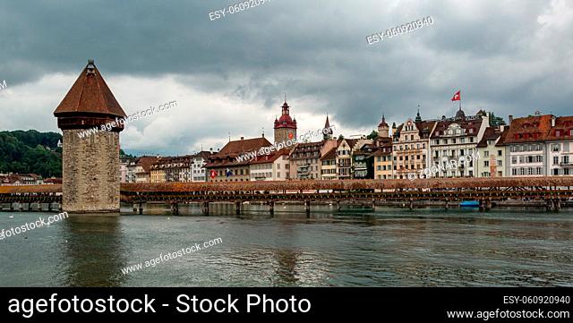 A picture of the city of Lucerne and the Reuss river, showcasing the Chapel Bridge (Kapellbrücke) landmark