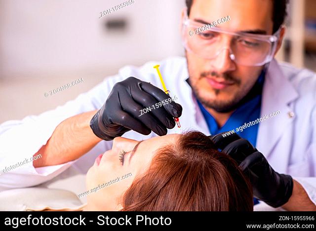 Young woman visiting beautician in hair transplantation concept
