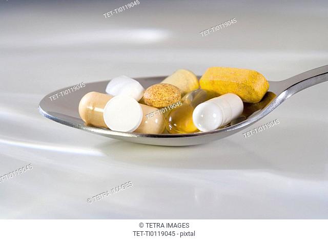 Still life of a spoonful of pills
