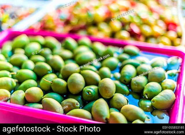 Assorted olives put up for sale on the italian street market stall