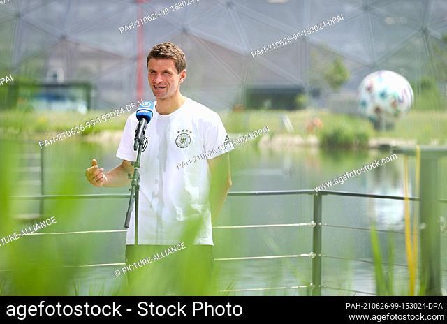 26 June 2021, Bavaria, Herzogenaurach: Football: European Championship, national team, Germany: Thomas Müller gives an interview in front of the media centre...