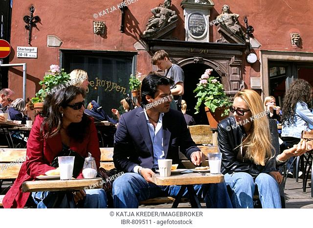People at a street cafe in the historic centre of Stortorget, Gamla Stan, Stockholm, Sweden, Scandinavia