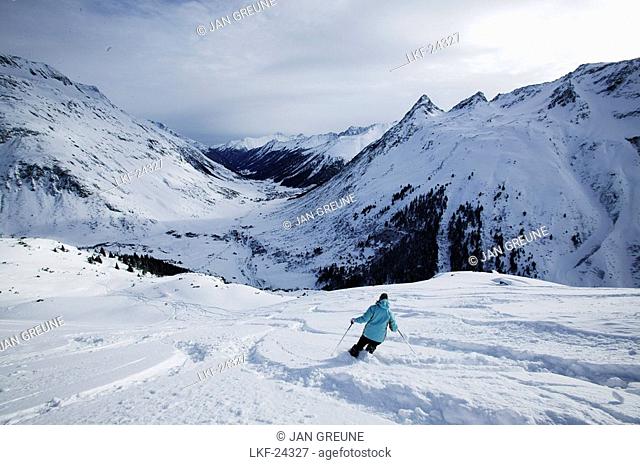 Person skiing in powder snow, Free Skiing, Ballunspitze, Wirl near Galtuer, Tyrol, Austria