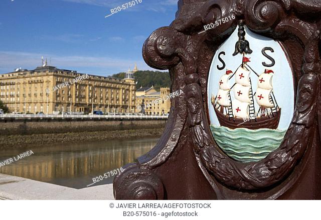 San Sebastian coat of arms. Santa Catalina bridge. Hotel Maria Cristina and Teatro Victoria Eugenia in the back, Urumea river, Donostia, San Sebastian, Gipuzkoa