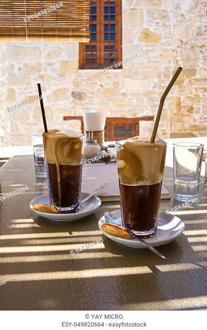 Two latte macchiatos served in an old cafe in Greece
