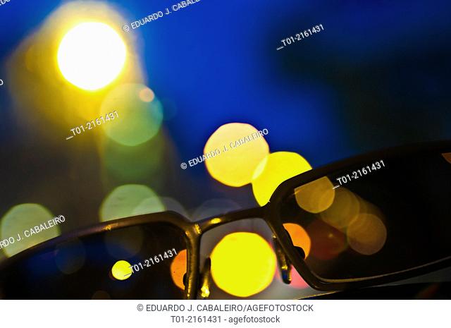 sunglasses with city lights background