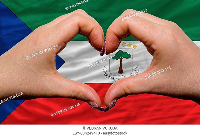 over flag of equatorial guinea showed heart and love gesture mad