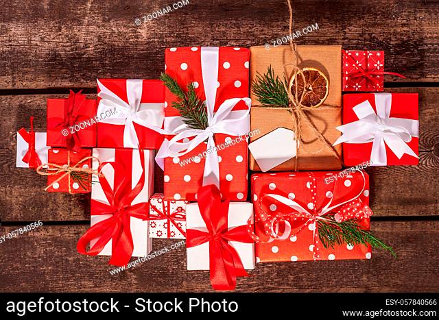 Gift box in wrapping paper with satin ribbon. Merry Christmas holiday concept