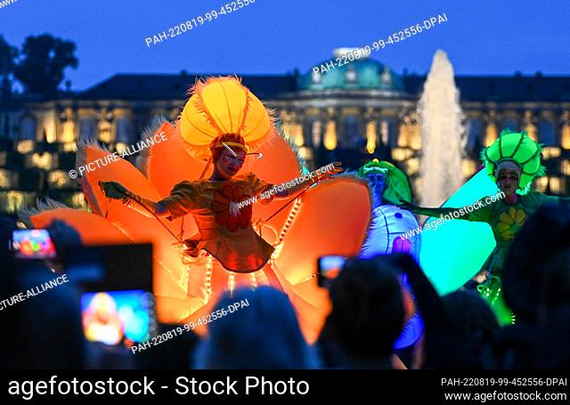 19 August 2022, Brandenburg, Potsdam: Artists from the group ""Flower Power"" will dance in Sanssouci Park at the Potsdam Palace Night 2022