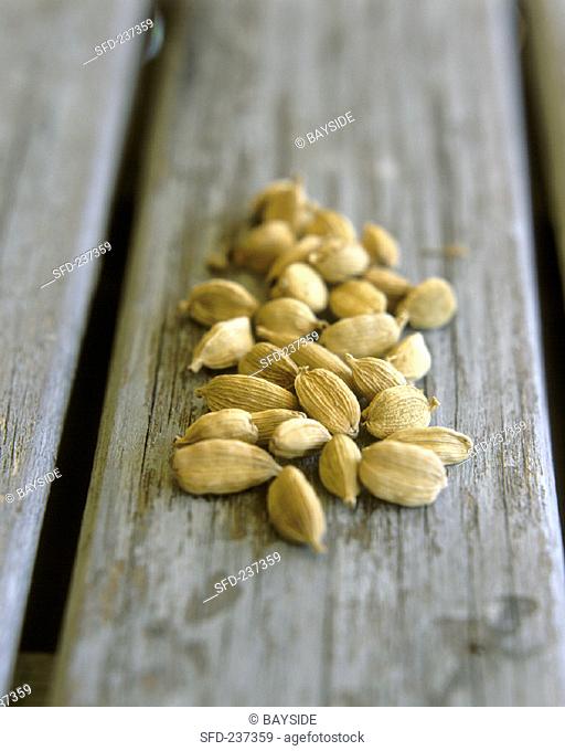 Cardamom on wooden background
