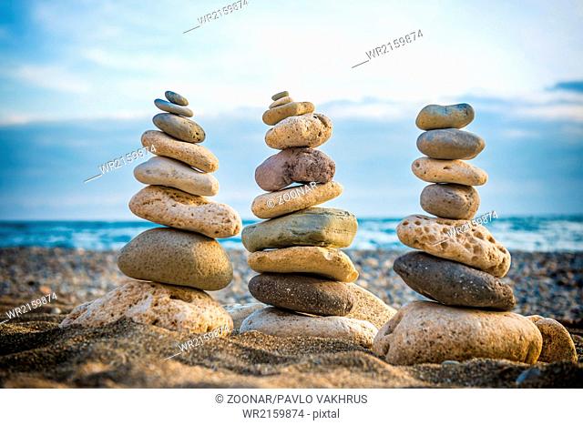 Three stacks of round smooth stones