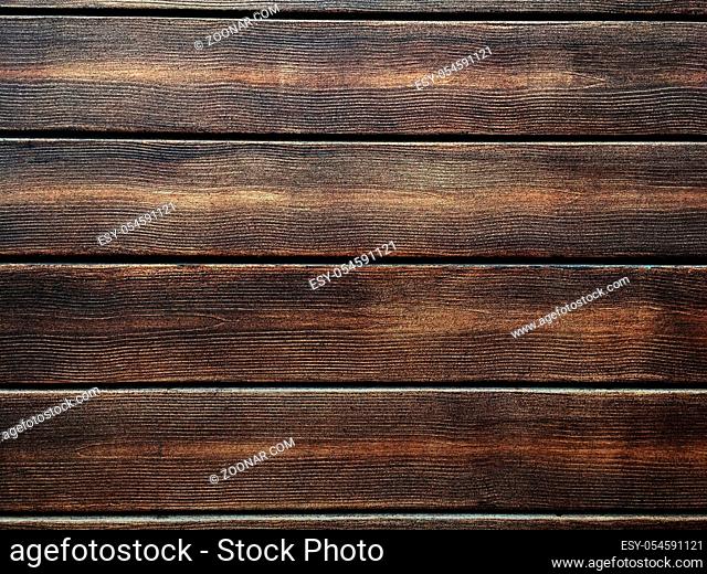 brown wooden texture background, dark oak of weathered distressed washed wood with faded varnish paint showing woodgrain texture