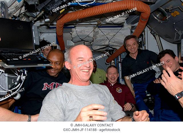 STS-129 and Expedition 21 crew members are pictured shortly after Space Shuttle Atlantis and the International Space Station docked in space and the hatches...