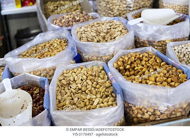 Peanuts and quicos (toasted maize) for sale in market. Valencia, Spain