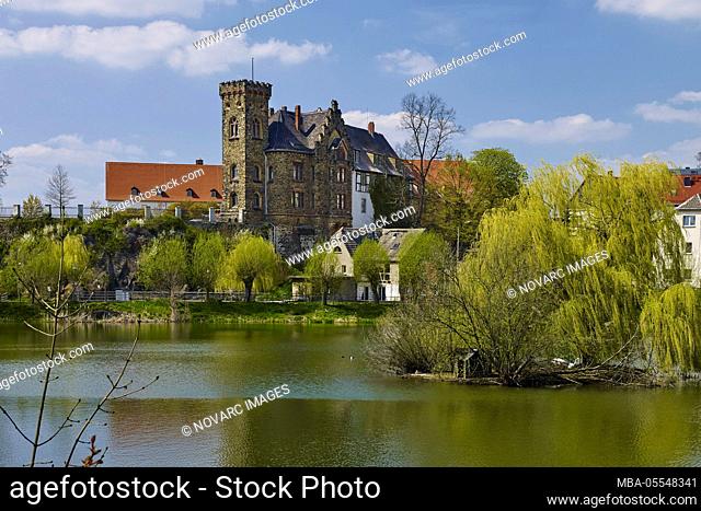 View over the bathing pond to the New Castle, Ronneburg, Thuringia, Germany