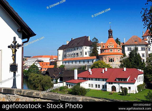 View from the hill with a crucifix (inscription in Czech- with Christ the world will be saved) on renaissance style castle, 16th century
