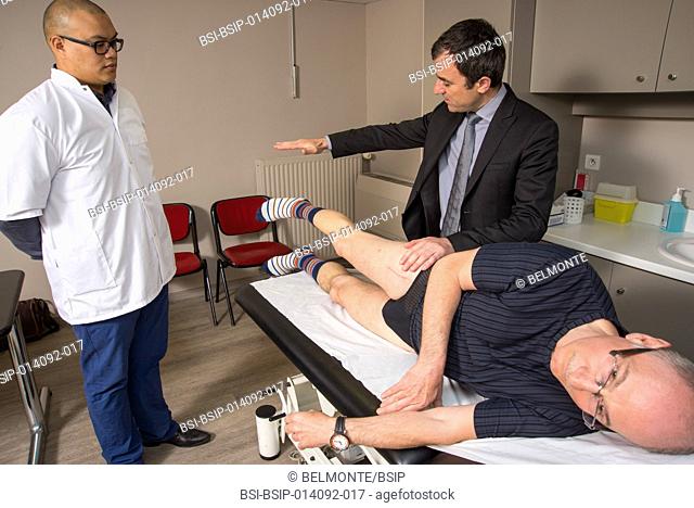 Reportage in Nollet Clinic in Paris, France. Post-op consultation (hip replacement) with Dr Nogier, a hip surgeon. Testing the gluteus medius muscle against...