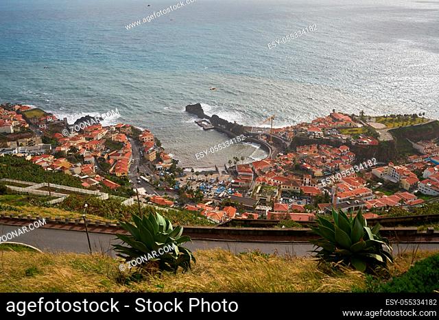 View of Miradouro da Torre viewpoint of the atlantic coastline with cactus in Câmara de Lobos, Madeira
