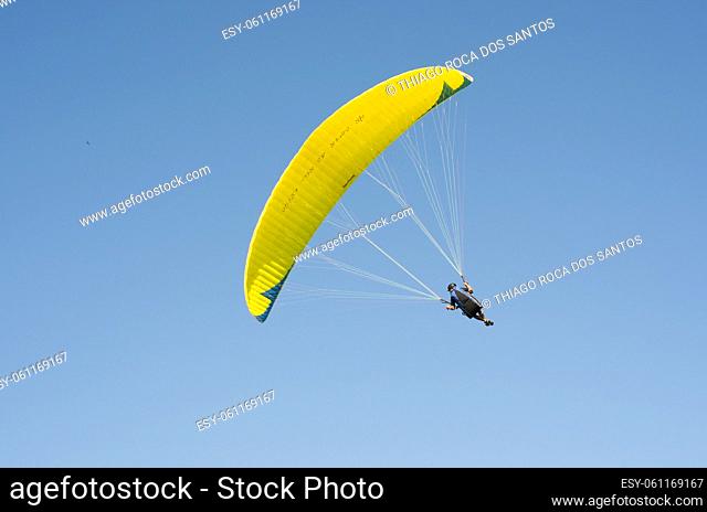 Camboriu, Brazil - December 10, 2017: Students practicing paragliding on the hill