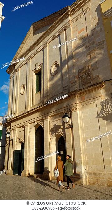 Tourists walking around the Sant Francesc da Asís Parish, a small church in Ciutadella, the second city of Menorca island, Balearic islands, Spain, Europe