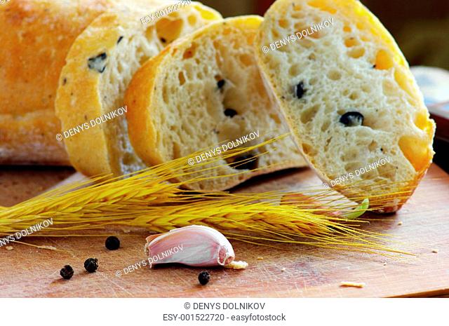 Close-up on traditional bread with olive. Shallow DOF