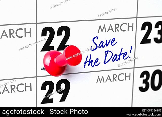 Wall calendar with a red pin - March 22