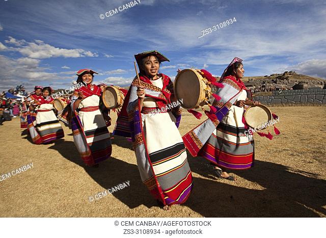 Indigenous people with traditional costumes during a performance at the Inti Raymi Festival in Saqsaywaman Archaeological Site, Cusco, Peru, South America