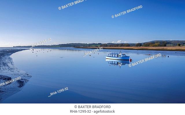 Turf Ferry moored on a mirror calm River Exe at Topsham, Devon, England, United Kingdom, Europe
