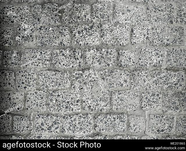 Gray walkway with stones in street texture background