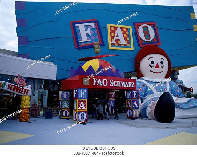 International Drive. Pointe Orlando Shopping Area. FAO Schwartz Toy Store chain colourful exterior with giant seated Raggedy Ann statue