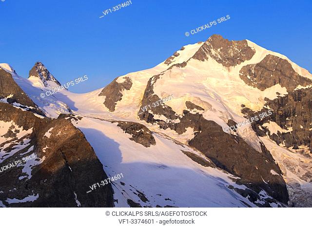 Piz Bernina and Cresta Aguzza at sunrise. Diavolezza Refuge, Bernina Pass, Engadin, Graubünden, Switzerland, Europe
