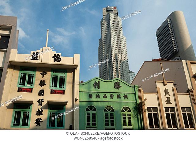 Singapore, Republic of Singapore, Asia - Old buildings along South Bridge Road with modern skyscrapers of the central business district in the backdrop