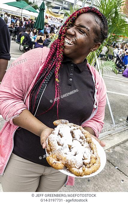 Florida, Miami, Miami-Dade College, Book Fair, annual event, Black, teen, girl, braided hair weave, dyed red, funnel cake, fashion fashionable