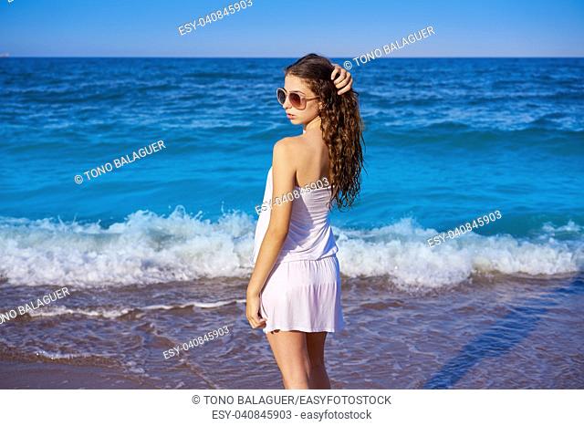 Girl in beach sea shore with summer white dress