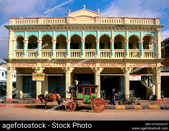 Burma / Myanmar: Horse-drawn carriage outside a colonial era cloth merchants factory, Pyin U Lwin (Maymyo), Mandalay Region