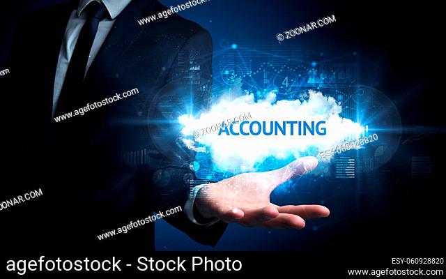 Hand of Businessman holding ACCOUNTING inscription, successful business concept
