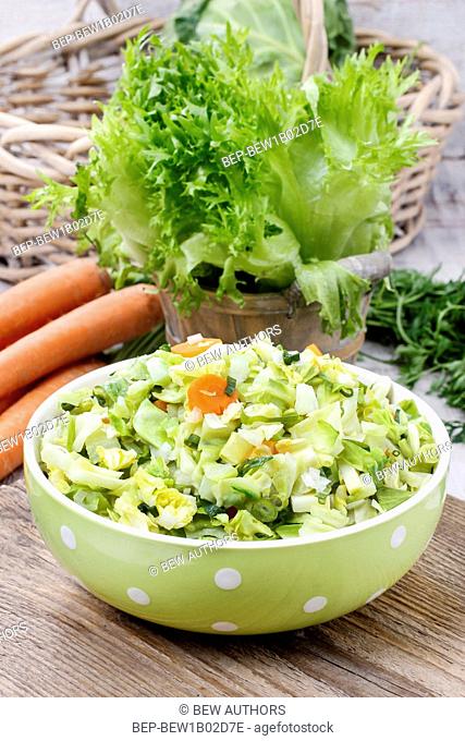 Fresh salad in green dotted bowl. healthy food