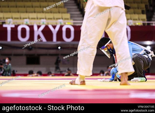 Illustration picture shows staff cleaning and disinfect the tatami before a 1/4 finals fight between Belgian Casse and Russian Khubetsov in the men under 81 kg...