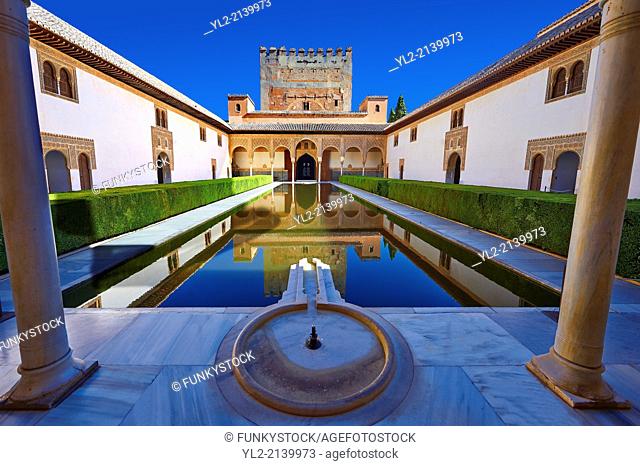 Arabesque Moorish architecture and pond of the Court of the Myrtles of the Palacios Nazaries, Alhambra. Granada, Andalusia, Spain
