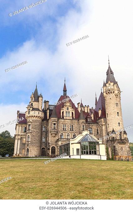 MOSZNA, POLAND - OCTOBER 07, 2016 : View on 17th century Moszna Castle on a sunny day.It is a historic castle and residence located in a small village
