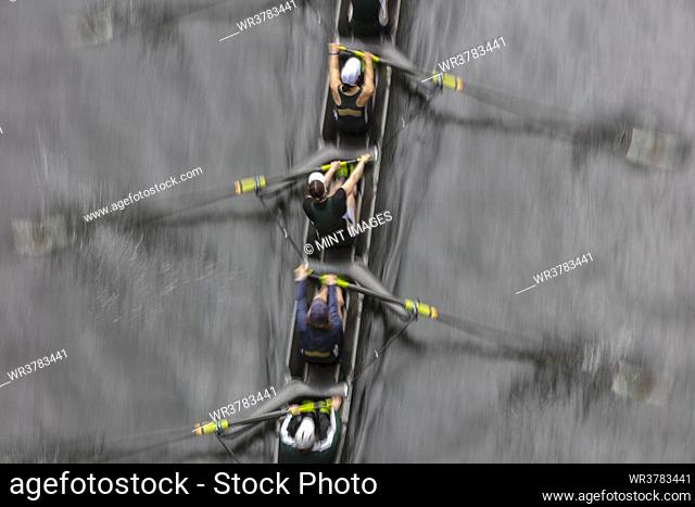 Overhead view of female crew racers rowing in an octuple racing shell, an eights team